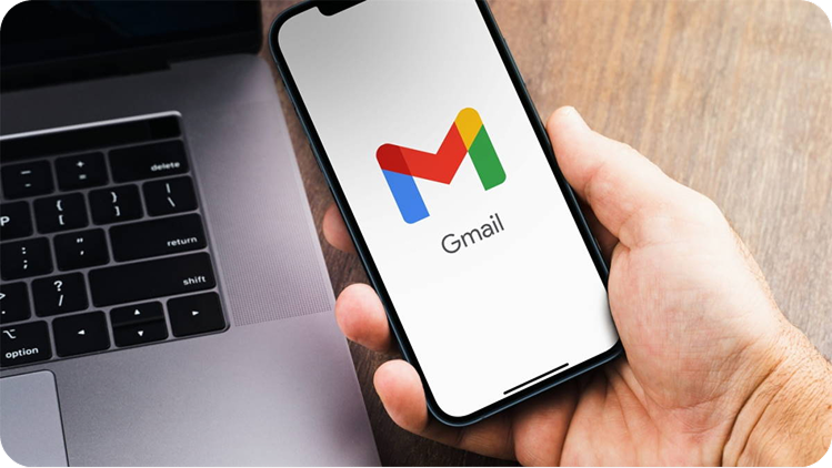 Hand holding phone with Gmail open